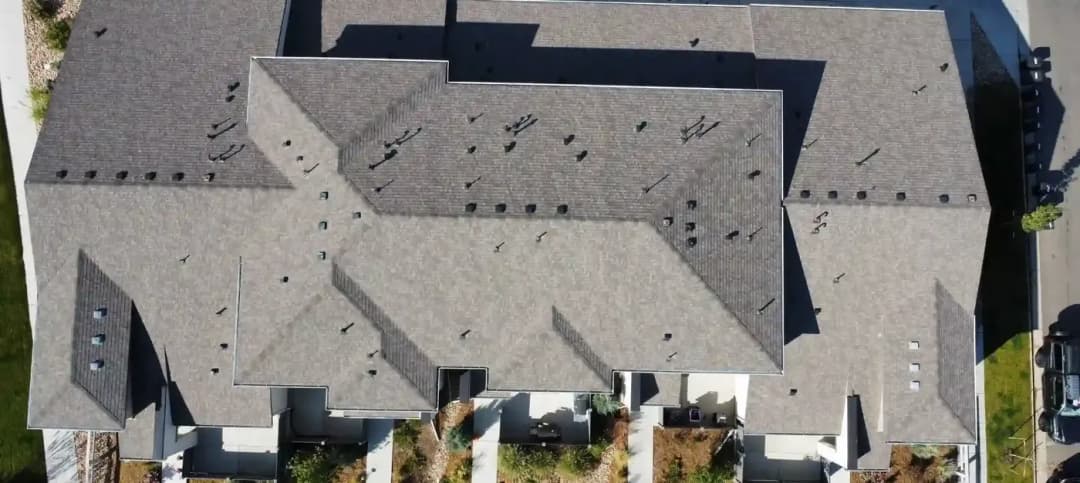 Hail inspection marks chalked on a shingle roof in the Denver area